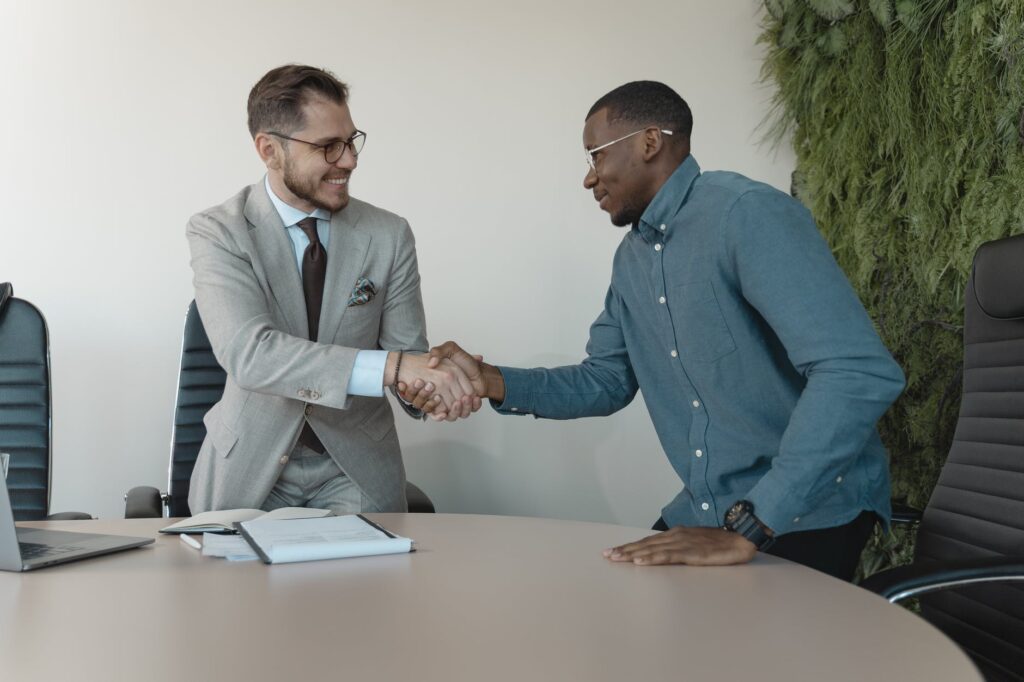 men shaking hands recruitment